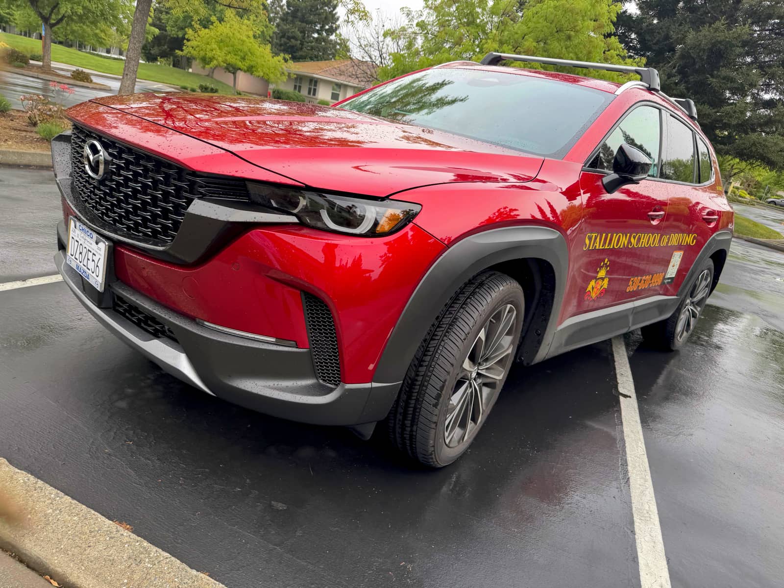 Front of Stallion's red Mazda CX-50 dual-control training SUV
